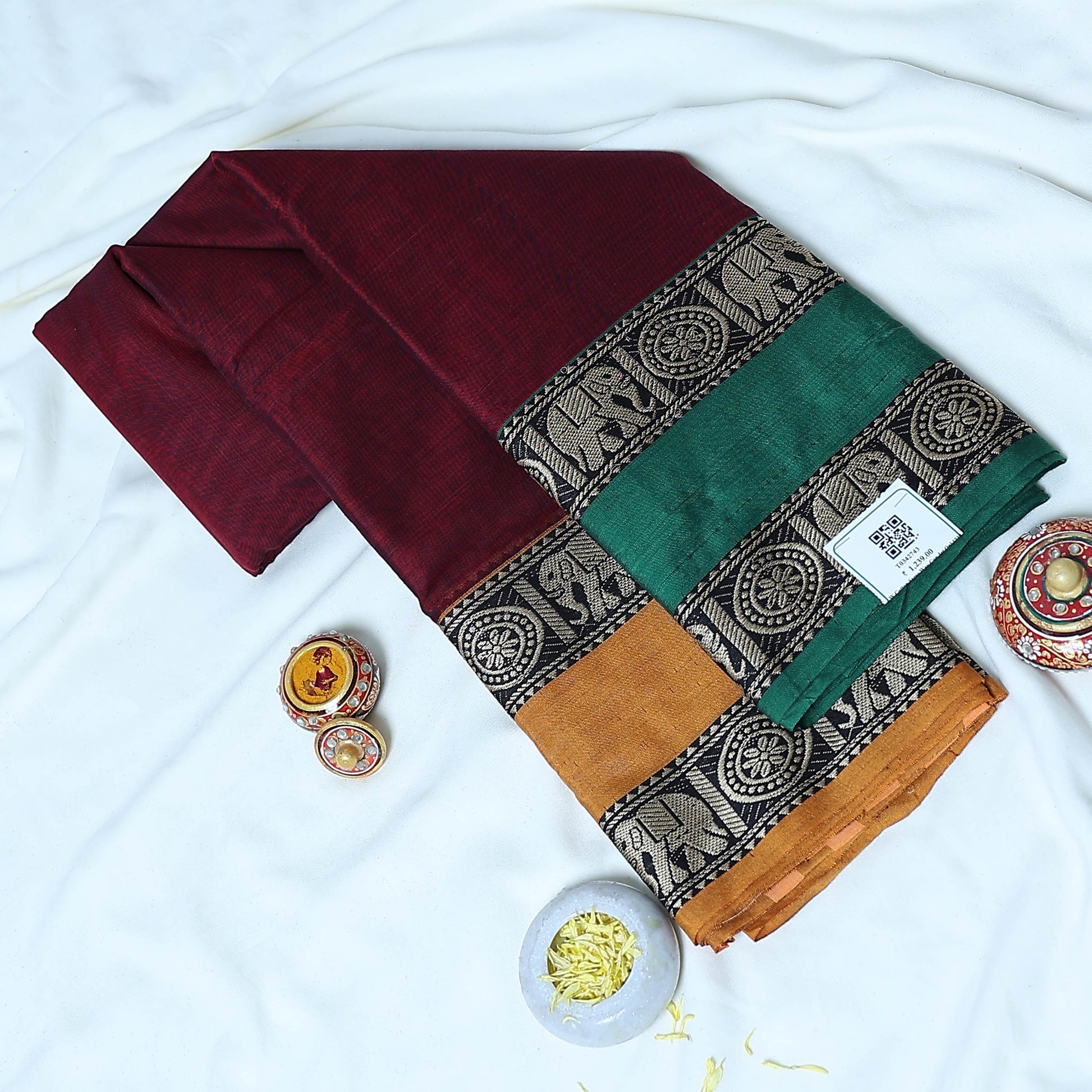 Mangalagiri Cotton Saree With Elephant Motif Border In Green, Mustard And Maroon Draped On Mannequin Front View