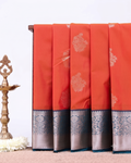 Elegant Niranjana Silk Saree with Intricate Floral Butta Weaving and Grand Traditional Zari Border - Orange