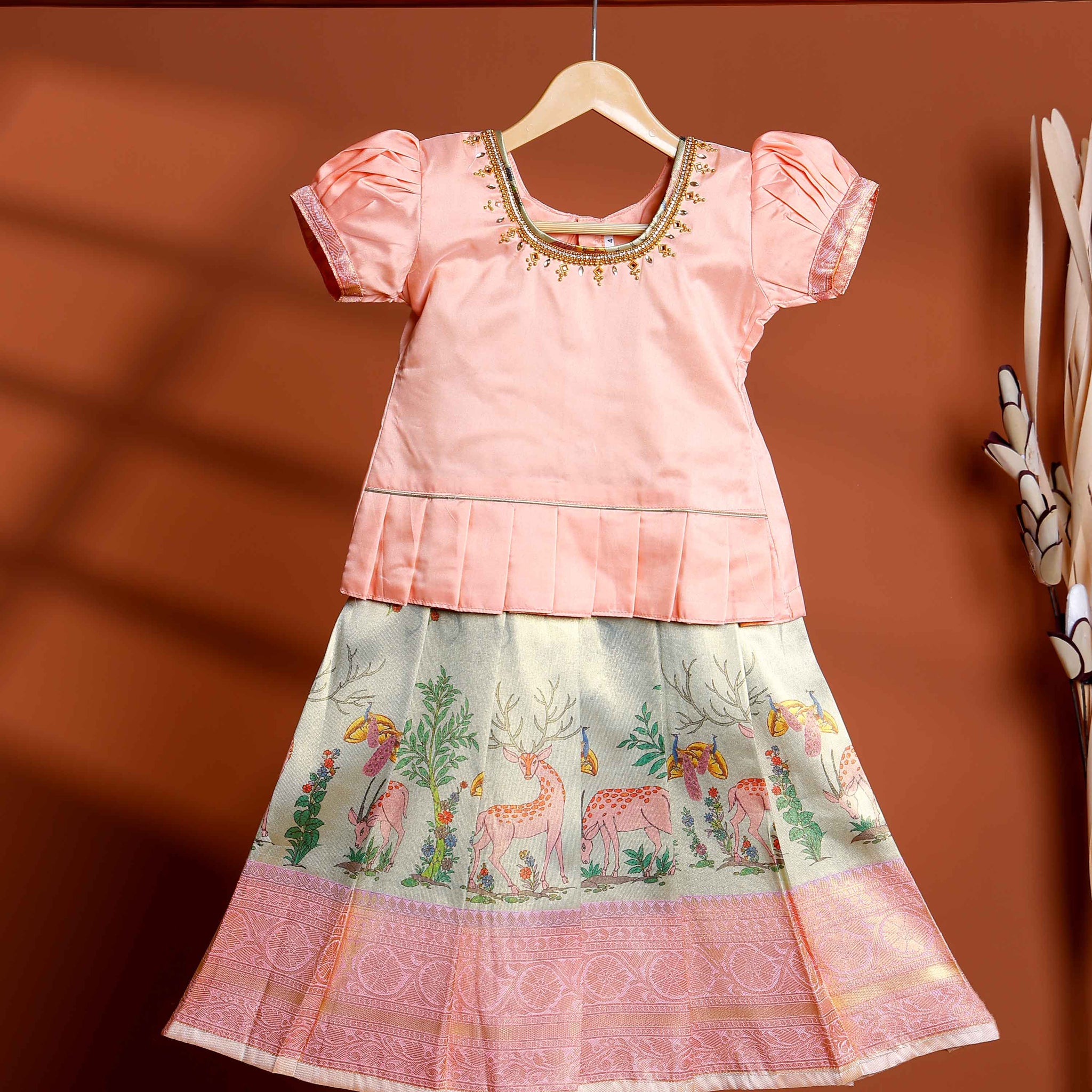 Kids Readymade Pattu Pavadai Set with Embellished Neck Puff Sleeve Blouse and Printed Skirt - Peach