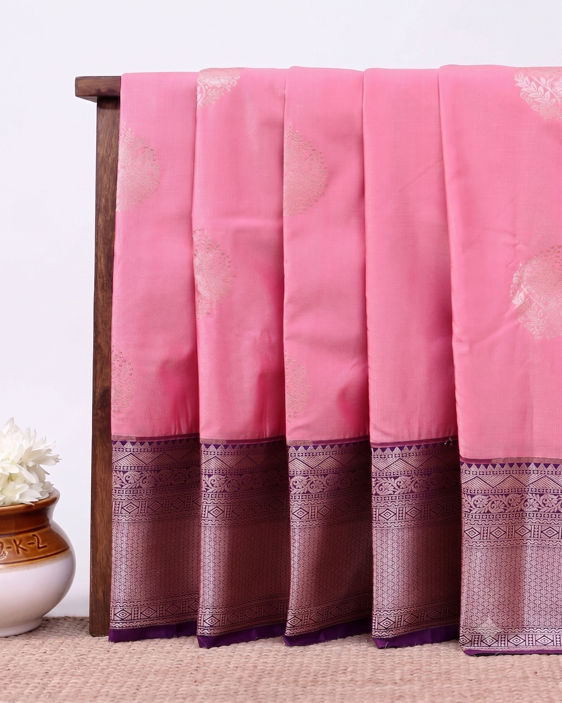 Traditional Niranjana Silk Saree Adorned with Woven Zari Motifs and a Contrasting Border - Pink