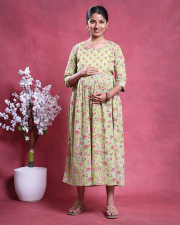 Light Green printed maternity wear with empire waist and three quarter sleeves front view