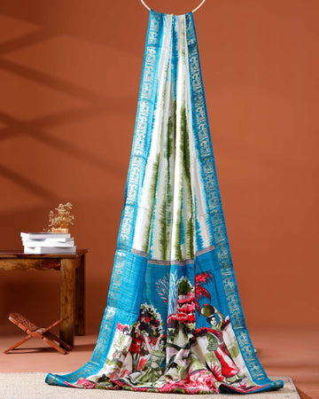 Elegant Blue shades and the rural scenic artwork Dola Saree