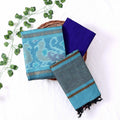Top View Of Aqua Blue And Blue Salwar Suit Material With Striped Dupatta, Ikkat Woven Border, Tassel Details & Fabric Piece