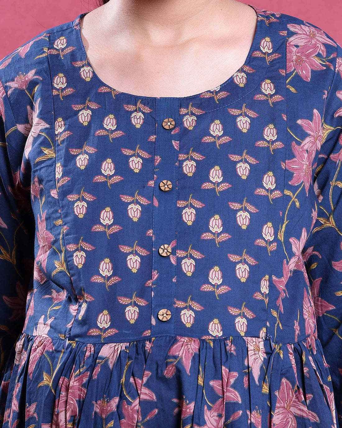 Maternity dress with floral print in blue and pink gathered waist and three quarter sleeves front view 