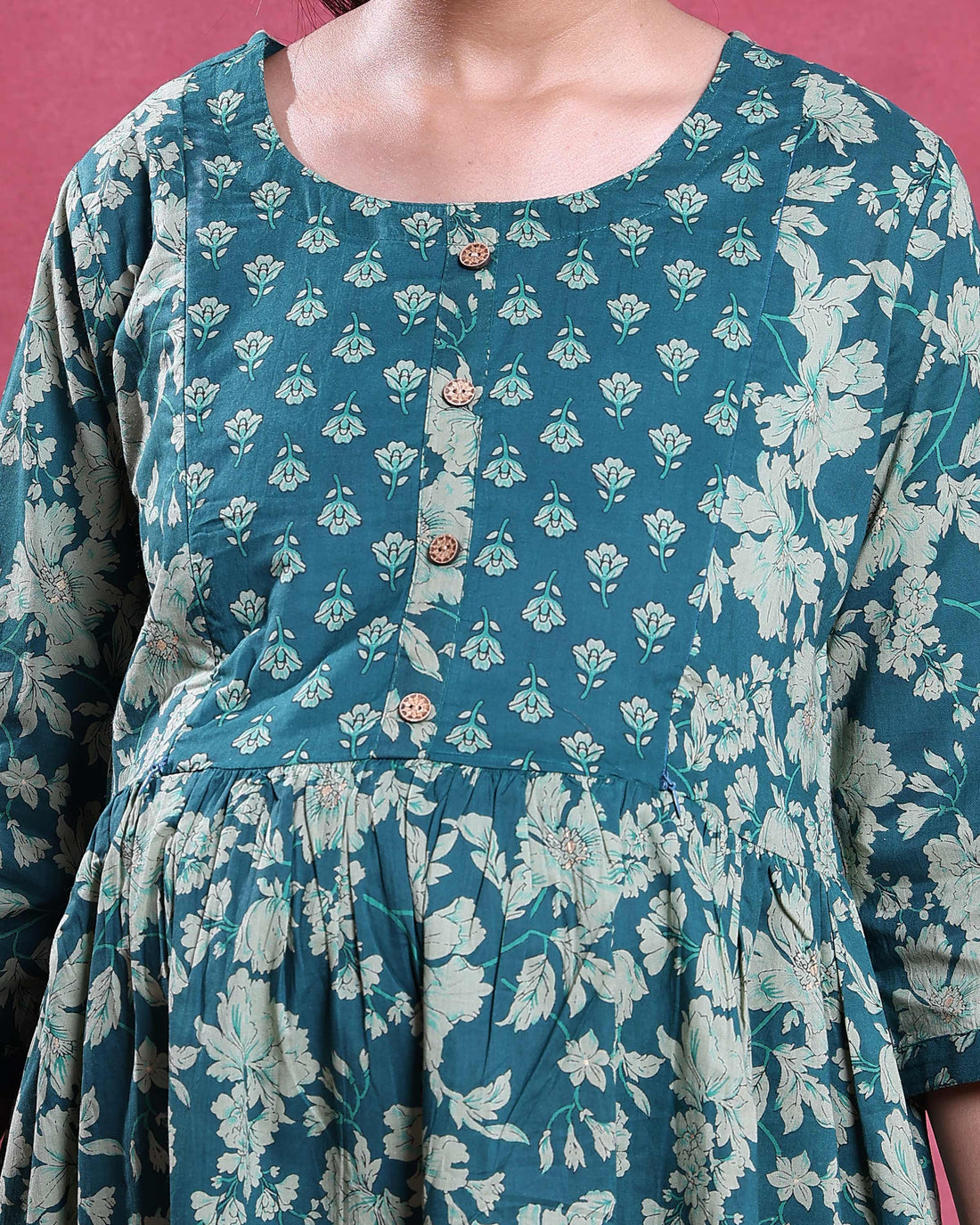 Maternity Wear with floral print in green gathered waist and three quarter sleeves front view on model