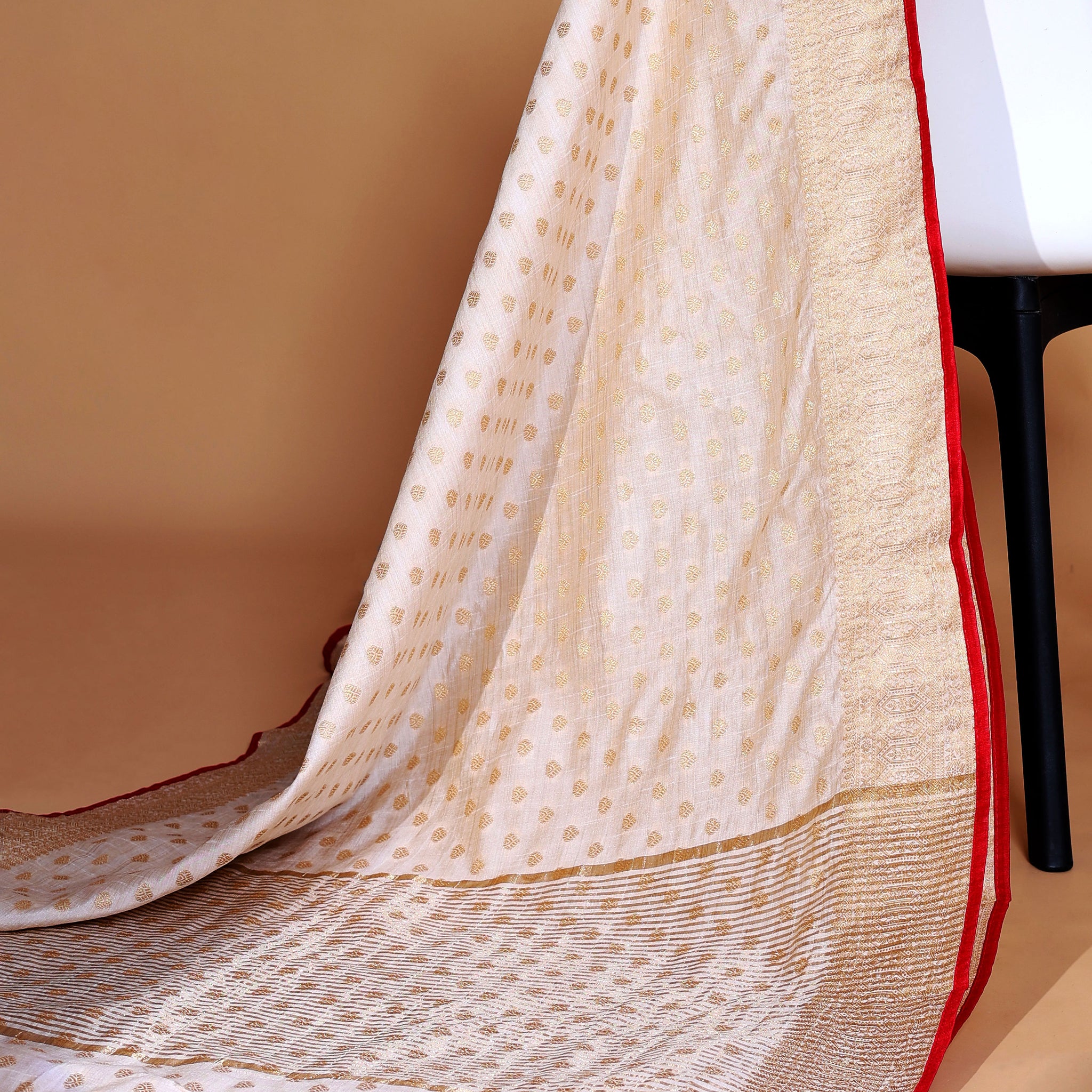 Off White   Art Silk Saree with Golden Zari & Buti Pattern Enhanced with Red Border