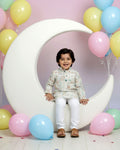 Boys green kurta adorned with traditional Bandhani-inspired patterns in red and gold., Multi