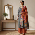 Grey Cotton Salwar Material With Striped Weave Orange Dupatta And Striped Border Front View