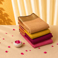 Kanchi Cotton Saree collection in beige, mustard yellow, magenta and pink shades with zari border stacked front view display