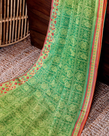 Elegant Lightweight Georgette Saree with Intricate Tribal Inspired Bandhani Motifs and Decorative Woven Border - Green