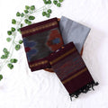 Top View Of Maroon And Grey Salwar Suit Material With Striped Dupatta Ikkat Woven Border Tassel Details And Matching Fabric Piece