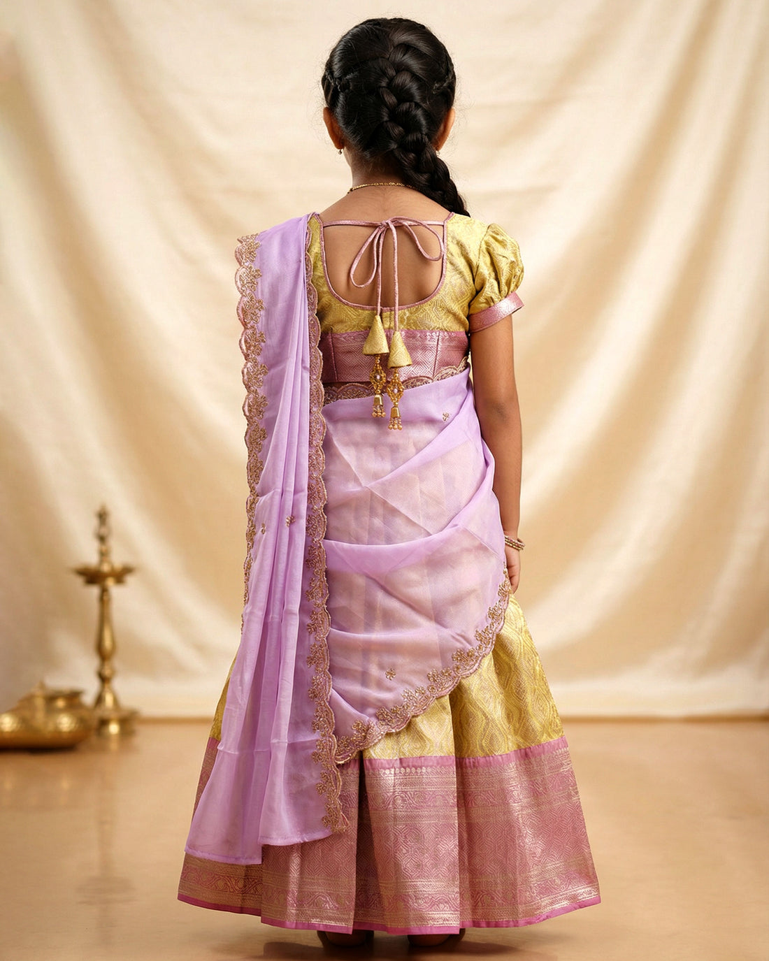 Traditional Girls Pavadai Dhavani Set with Zari Woven Diamond Pattern Skirt Brocade Border and Embroidered Lace Dupatta - Gold and Lavender