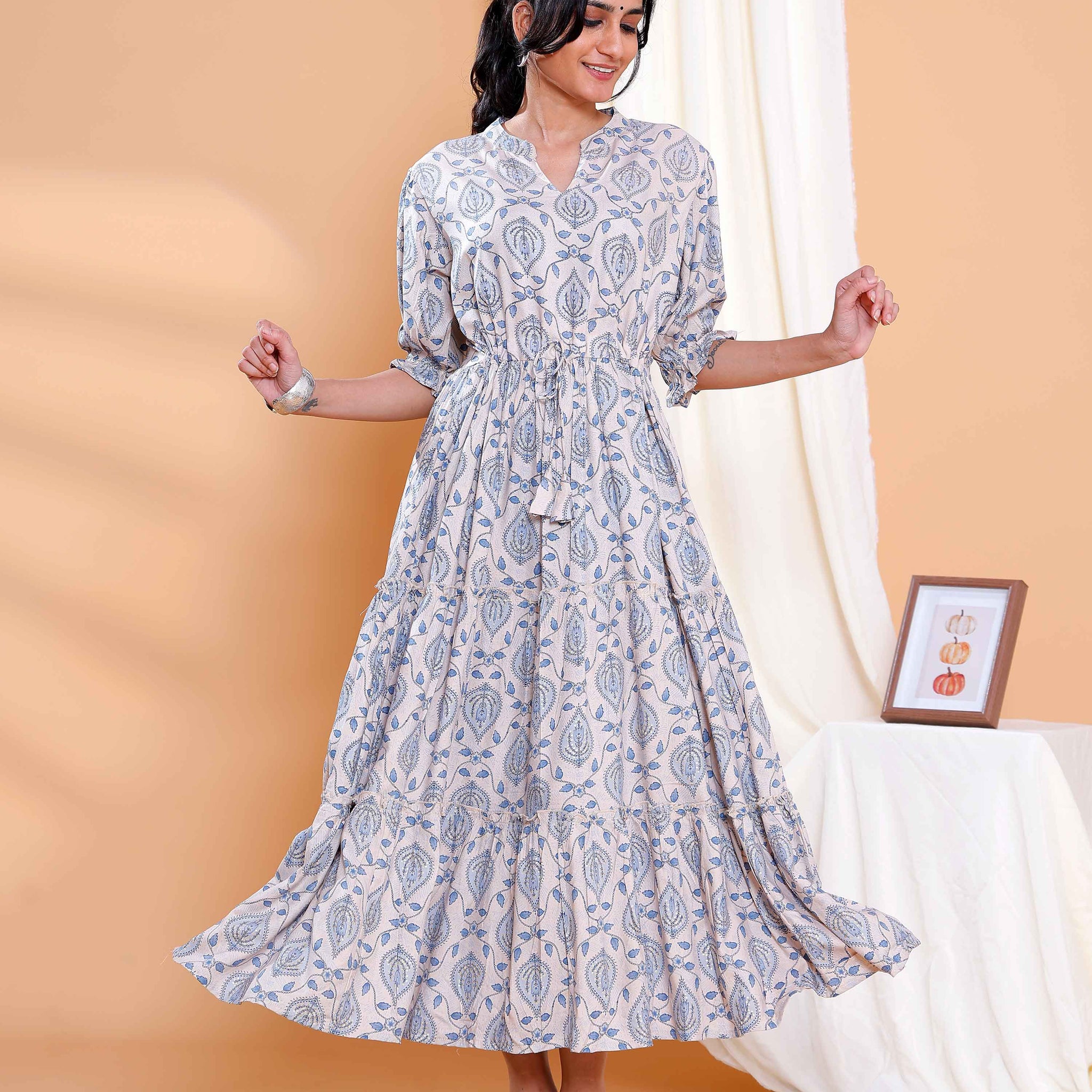 Elegant Beige Long Dress with Blue Leaf Motifs and Flared Hem