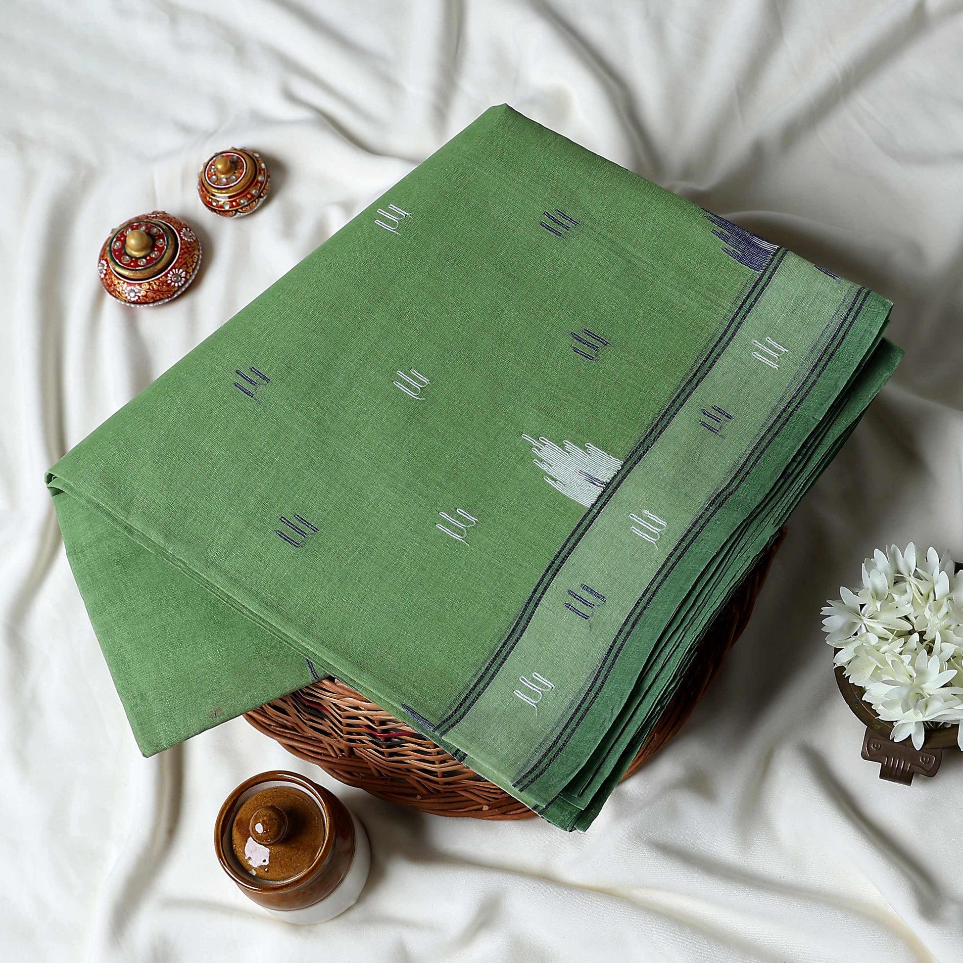 Bengal Cotton Saree With Traditional Woven Motifs And Contrast Border In  Green  Folded Front View