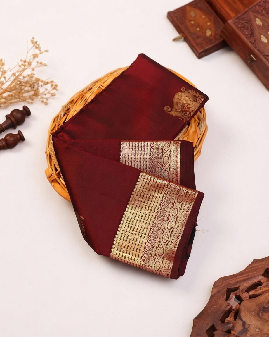 Exquisite Niranjana Silk Saree with Intricate Zari Weave and Peacock Motif - Maroon