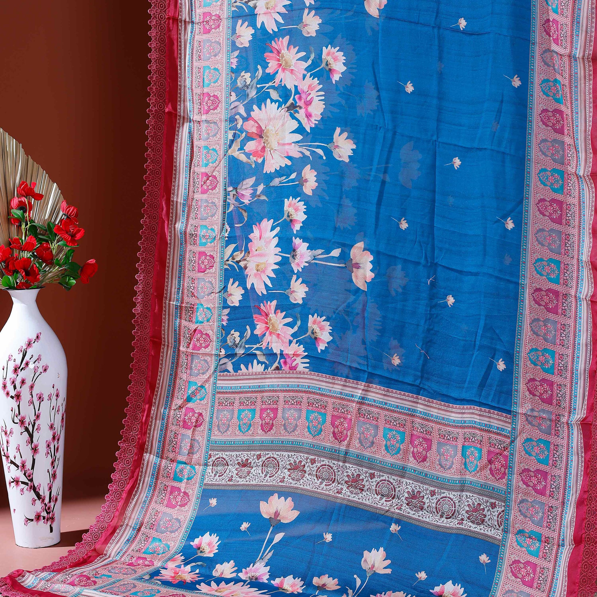 Stylish Georgette Saree with Bold Floral Prints and Traditional Patterned Border - Blue