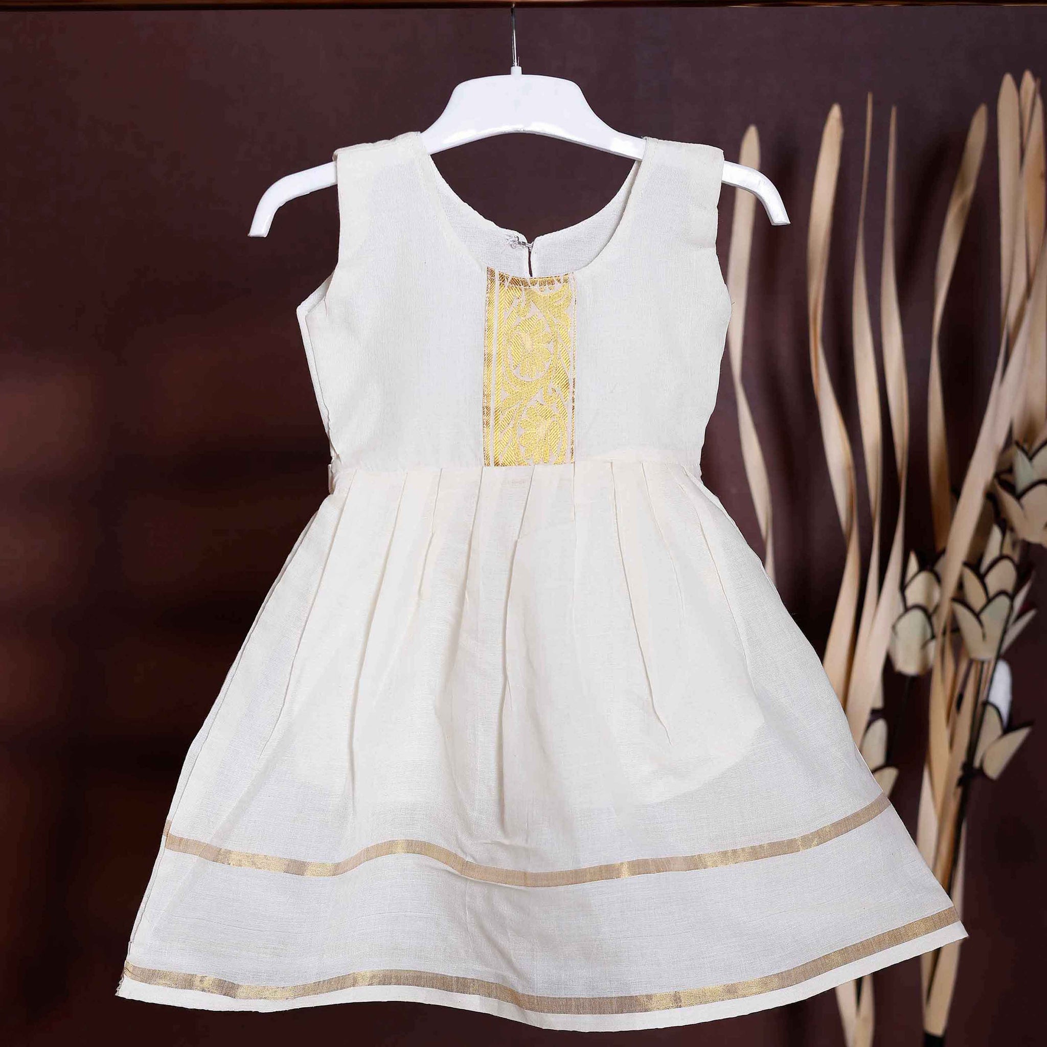 Traditional Kerala Kasavu Style Girls' Frock with Gold Zari Border and Neckline Embellishment - Cream