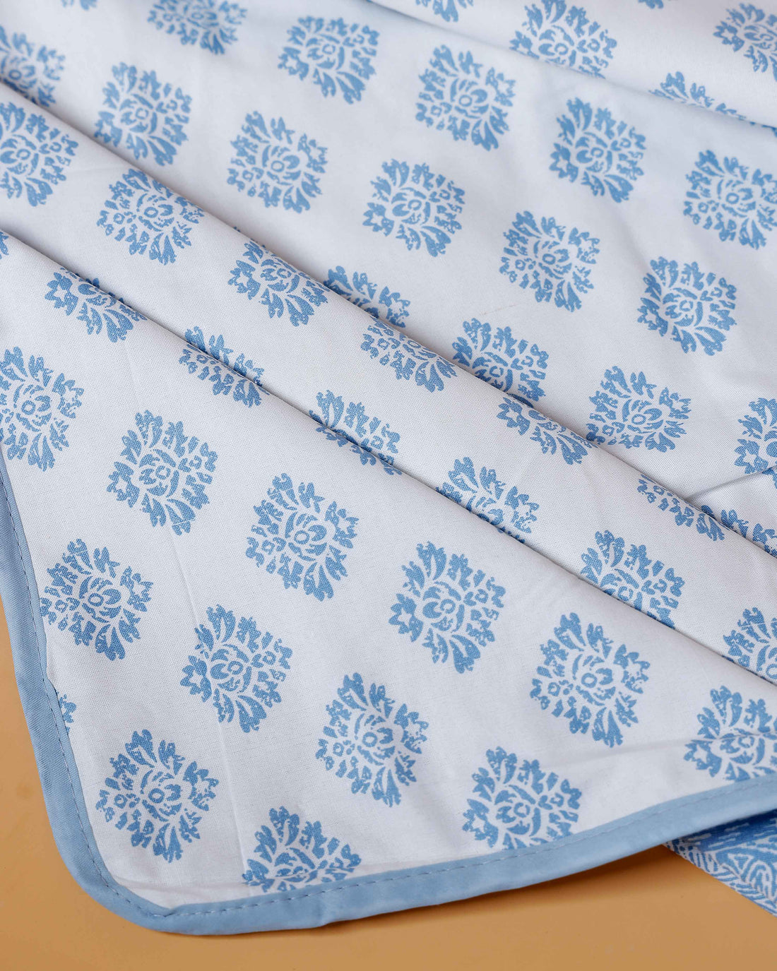 Reversible Cotton Double Quilt with Tribal Block Print and Floral Motifs - Blue