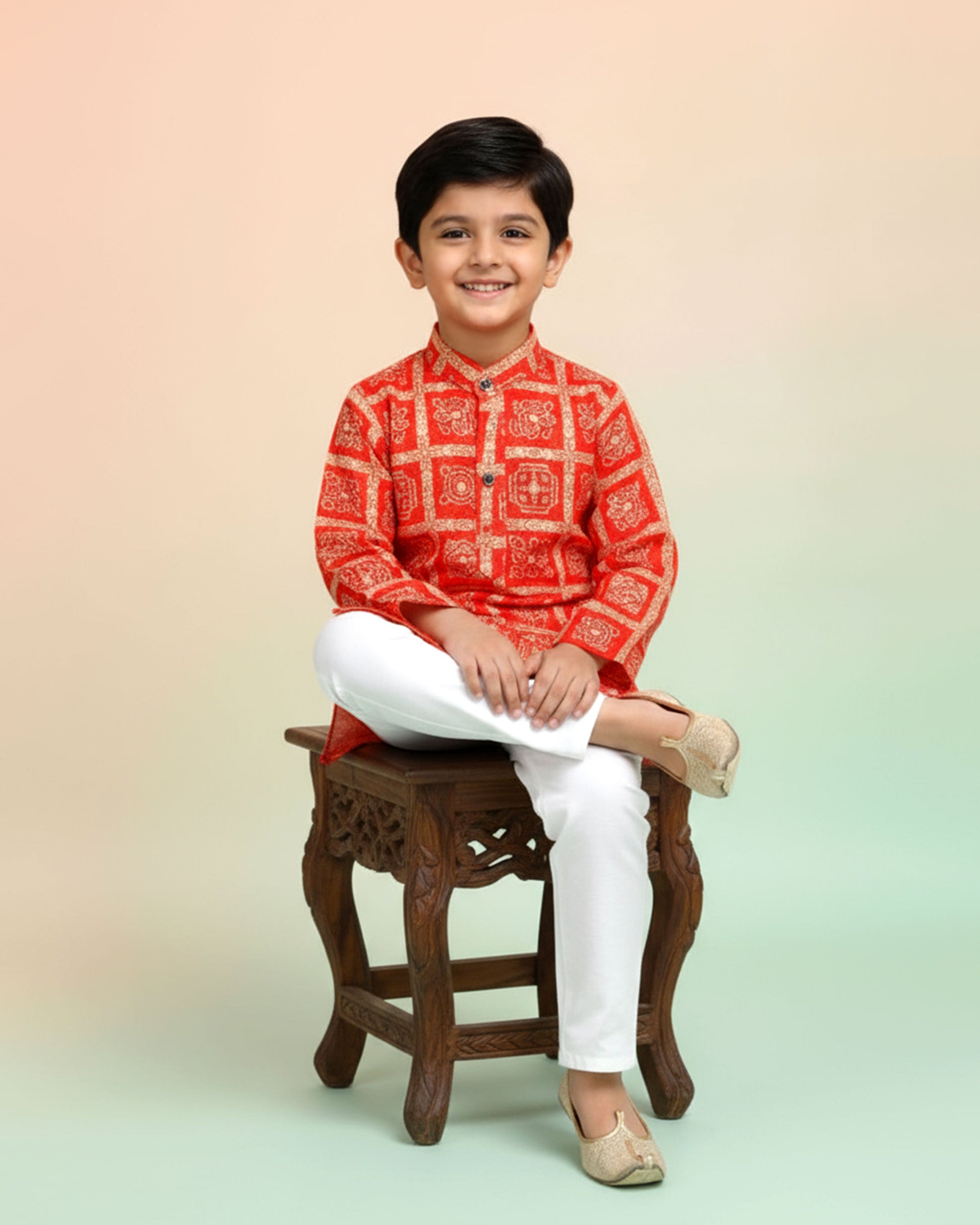 Boys green kurta adorned with traditional Bandhani-inspired patterns in red and gold., Orange