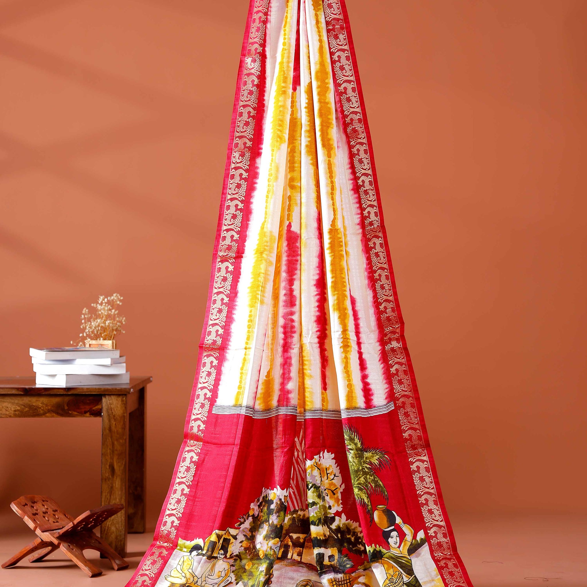 Elegant Red shades and the rural scenic artwork Dola Saree