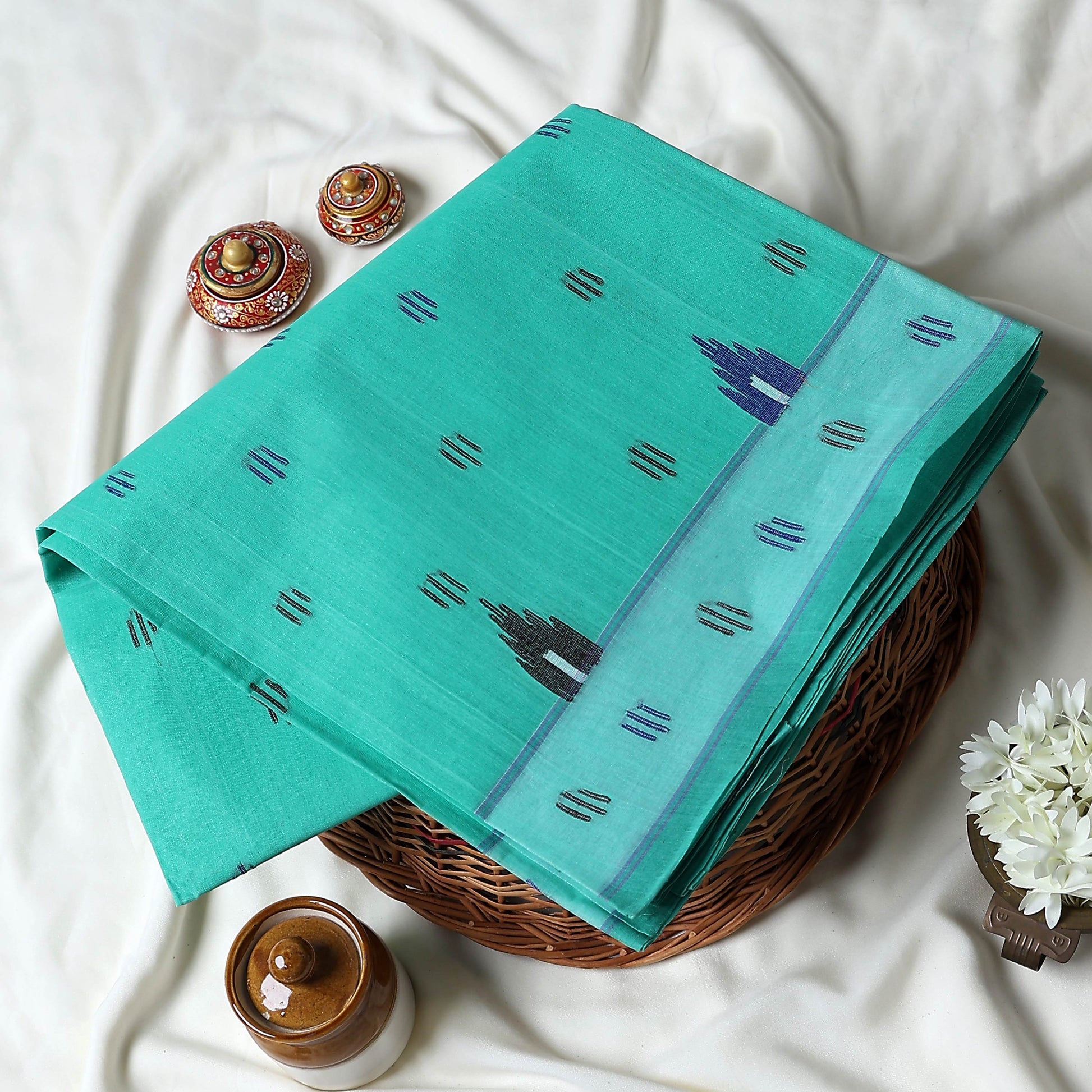Bengal Cotton Saree With Traditional Woven Motifs And Contrast Border In Aqua Green Folded Front View