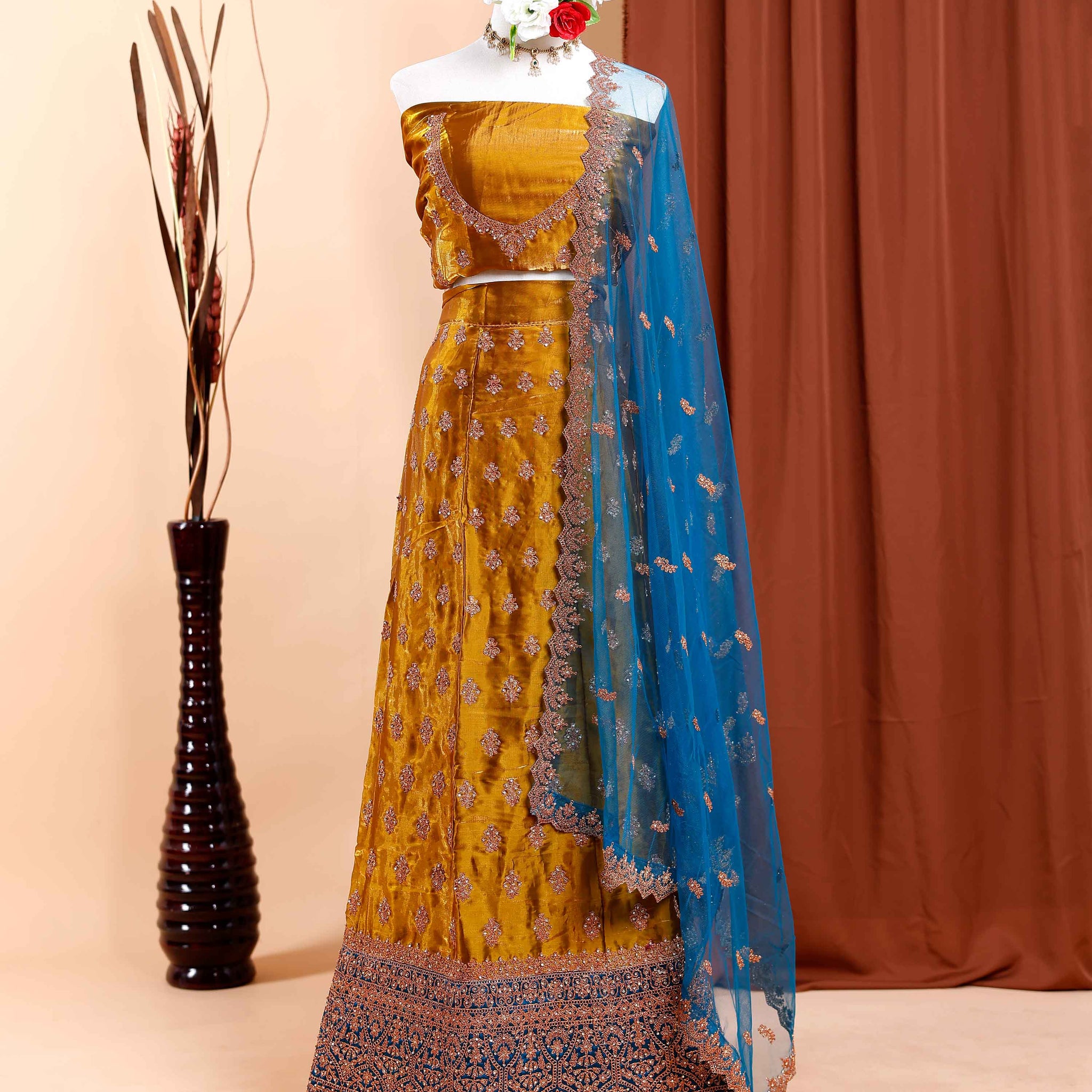 Embellished Semi-Stitched Lehenga Choli with Intricate Embroidery and Jacquard Border Detailing  - Gold