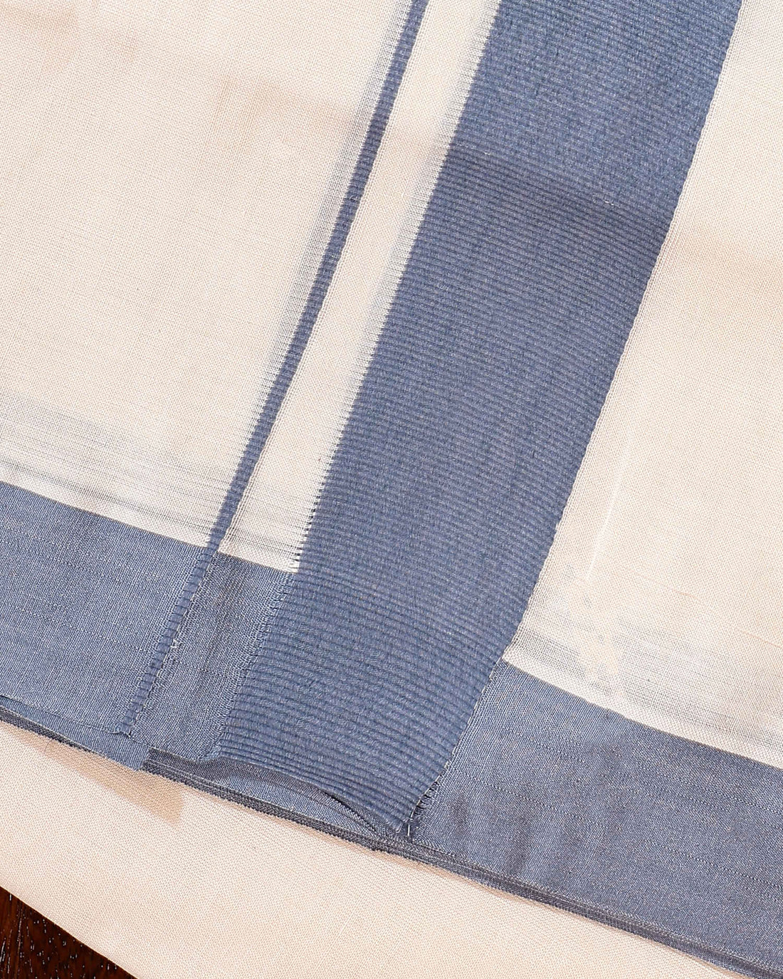 Traditional Handwoven Cotton Dhoti with Light Blue Border and Elegant Finish - Off White