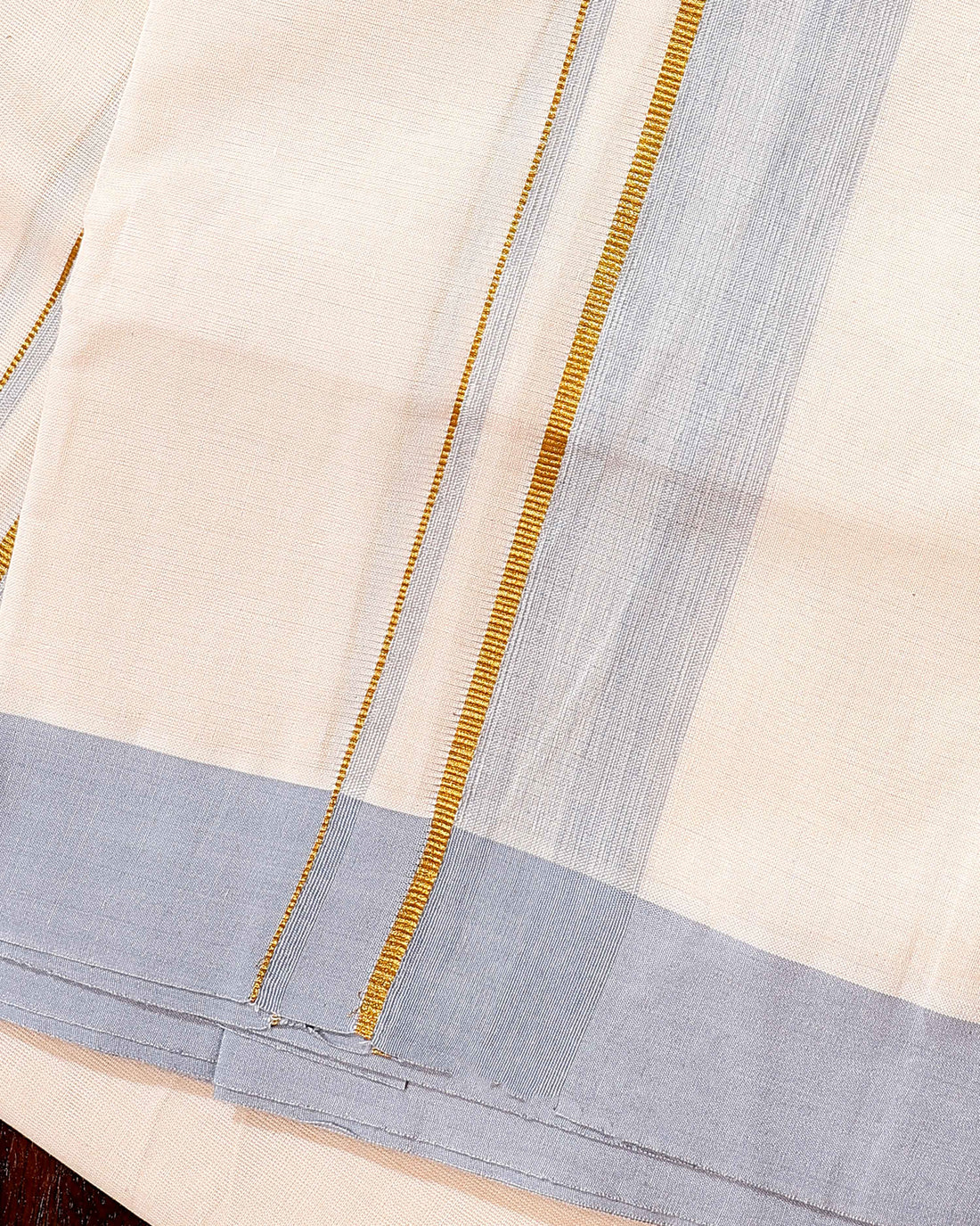 Traditional Handwoven Cotton Dhoti with Light Blue Border and Elegant Finish - Off White
