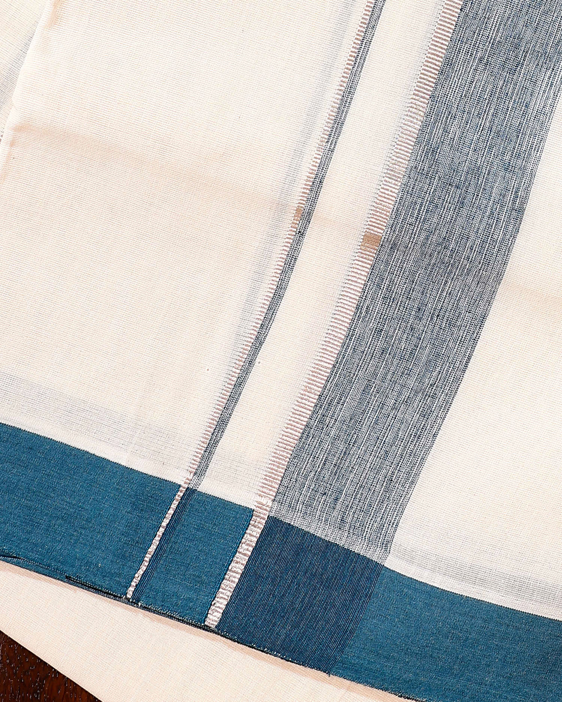 Traditional Handwoven Cotton Dhoti with Teal Border and Elegant Finish - Off White