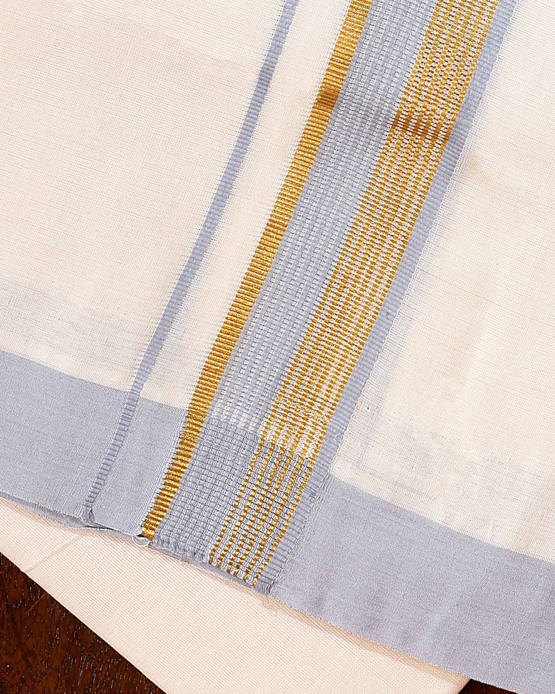 Traditional Handwoven Cotton Dhoti with Light Blue Border and Elegant Finish - Off White