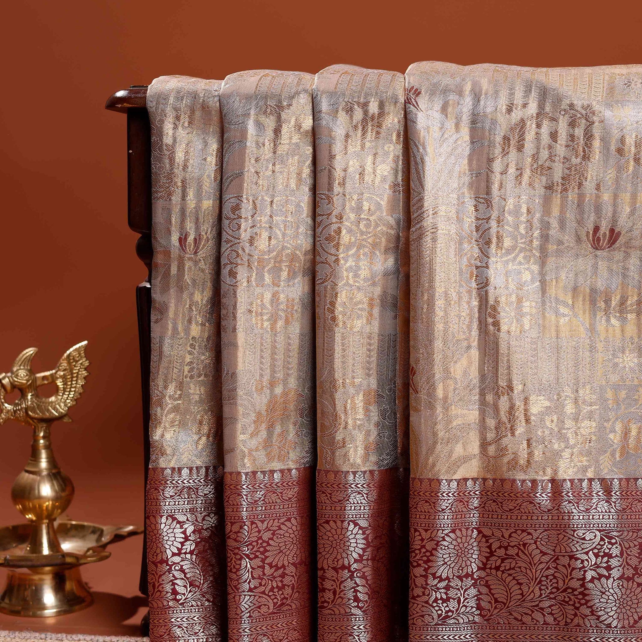 Elegant Niranjana Silk Saree with Intricate Zari Weaving and Contrasting Floral Border - Brown