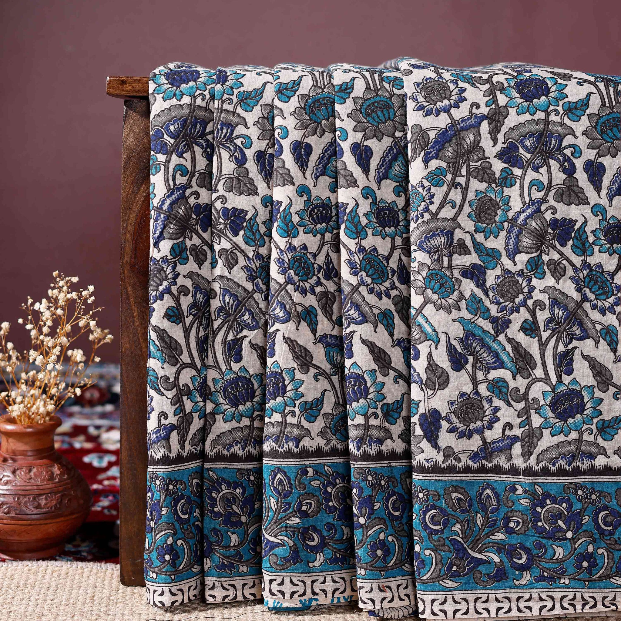 Traditional Kalamkari Cotton Saree Intricate Floral Motifs and a Distinctive Border Design - Cream