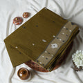 Bengal Cotton Saree With Woven Buti Motifs And Contrast Border In Olive Green Draped On Mannequin -  Front View