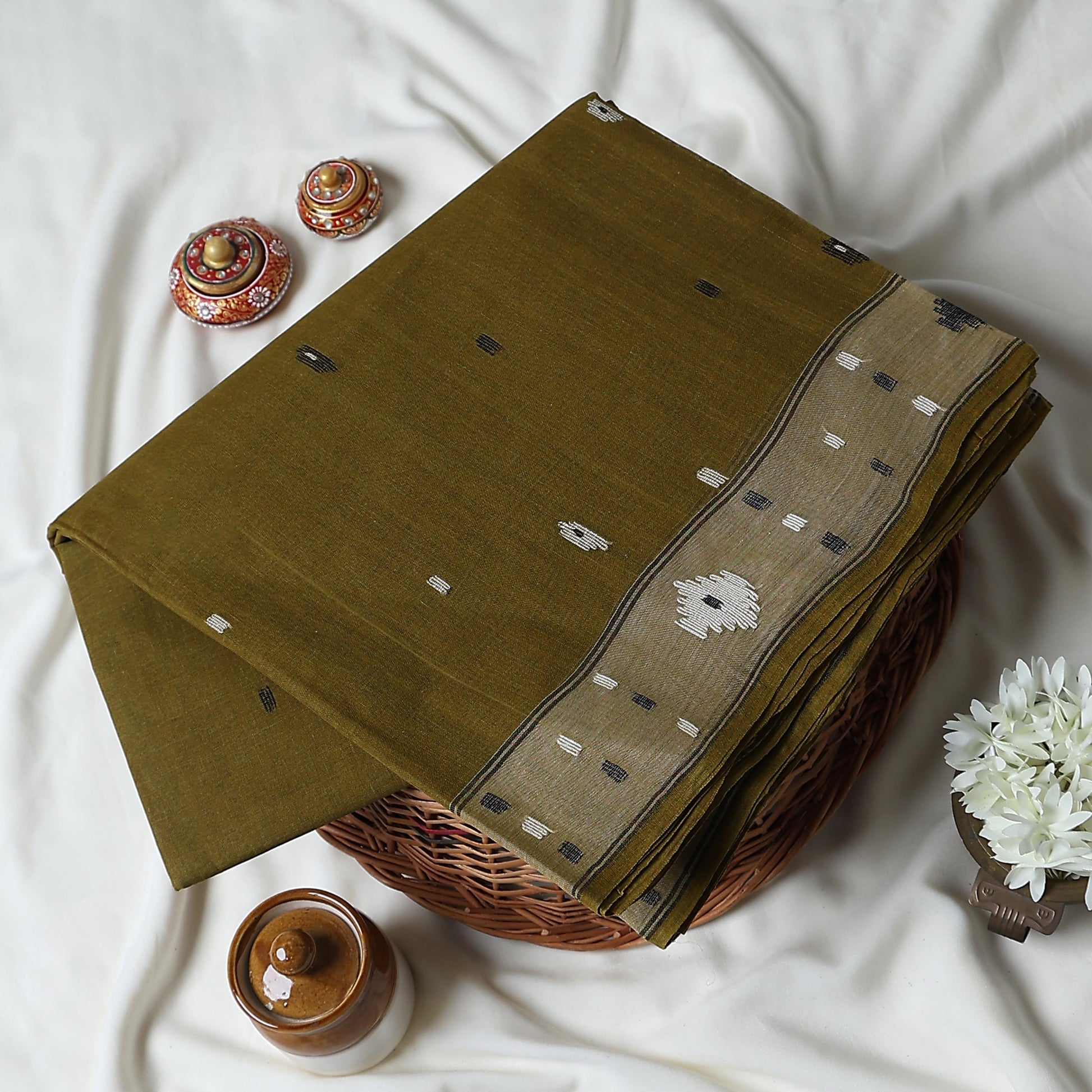 Bengal Cotton Saree With Woven Buti Motifs And Contrast Border In Olive Green Draped On Mannequin -  Front View