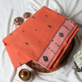 Bengal Cotton Saree With Woven Buti Motifs And Contrast Border In Light Orange Folded Display  - Close Up View