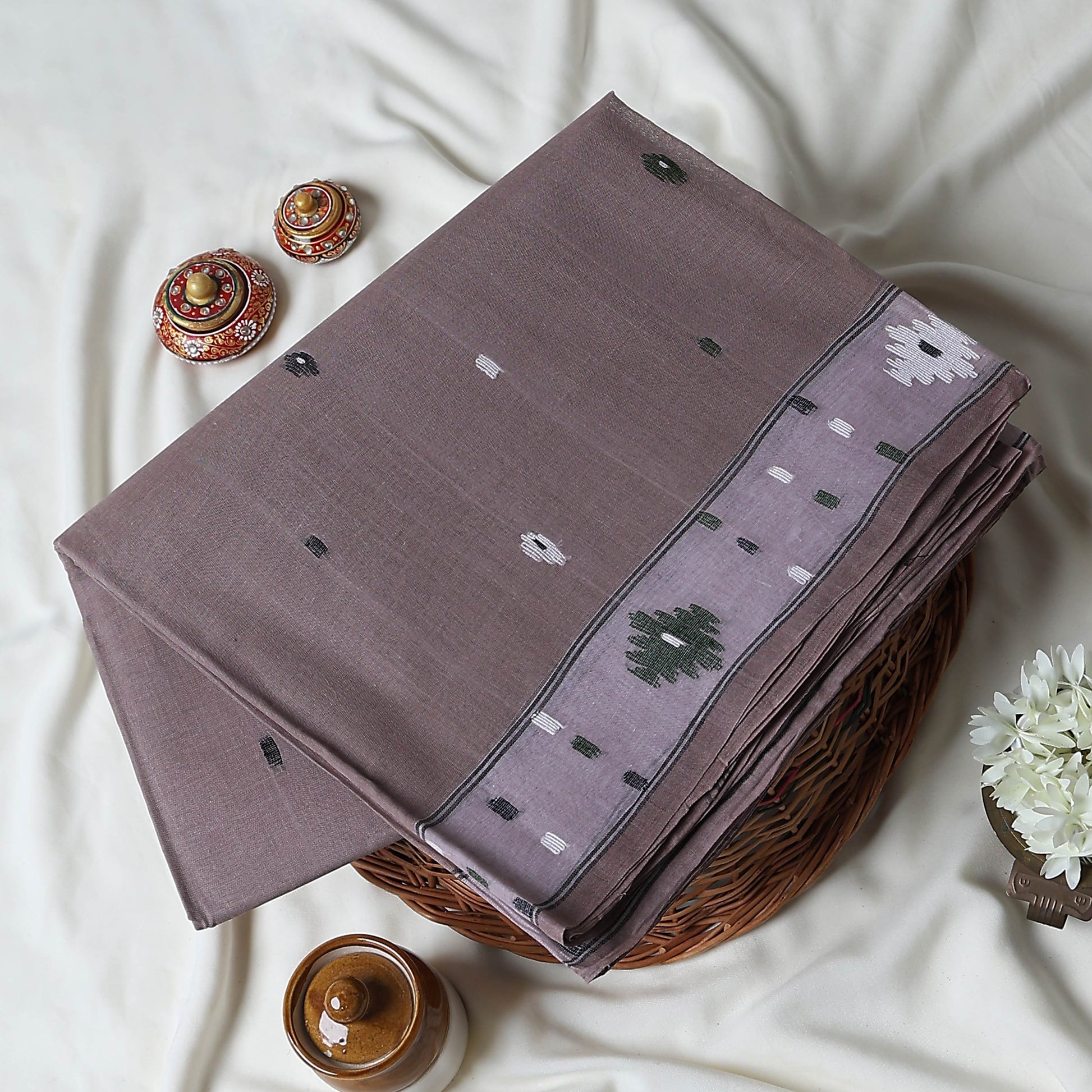 Bengal Cotton Saree With Woven Buti Motifs And Contrast Border In Light Brown Folded Display  - Close Up View
