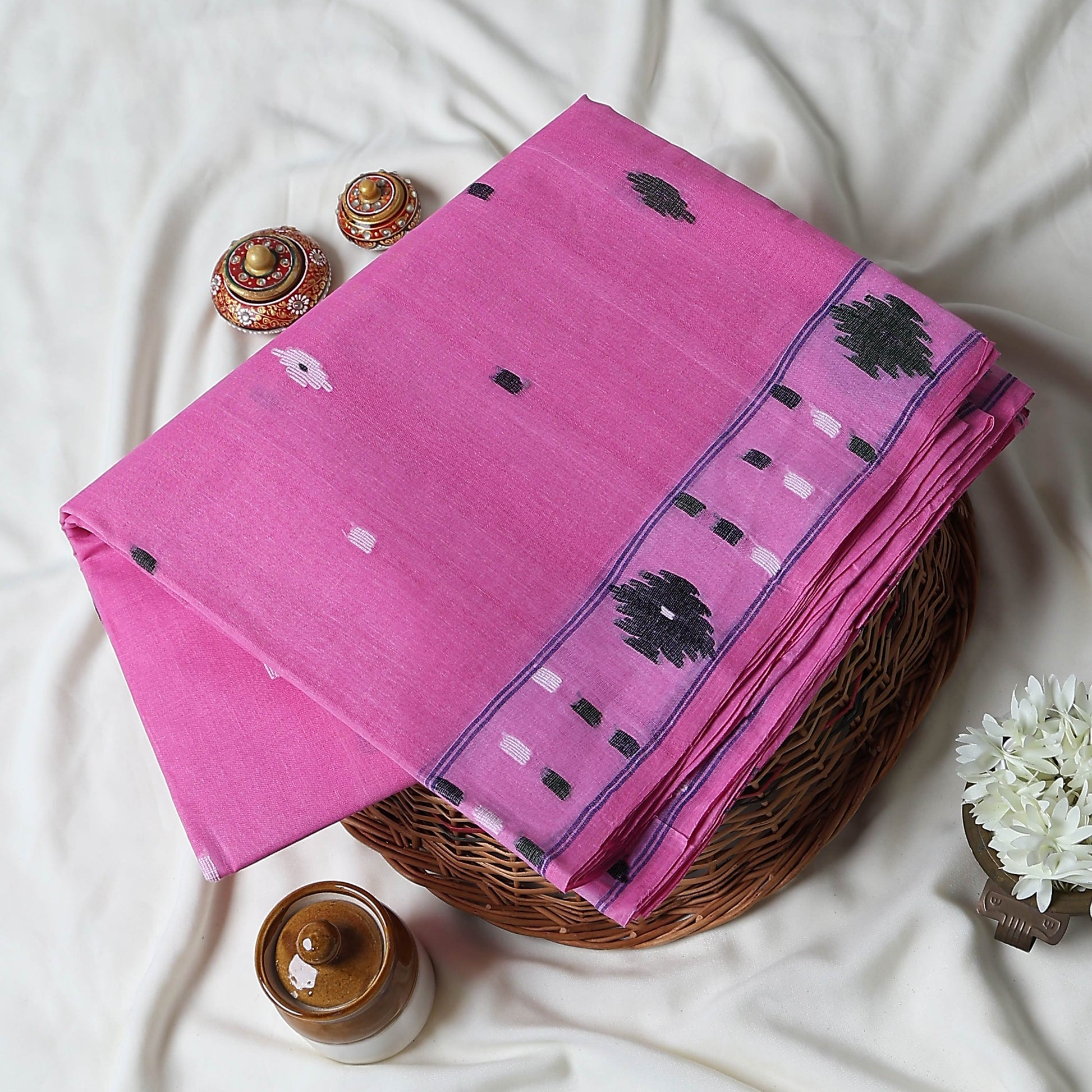 Bengal Cotton Saree With Woven Buti Motifs And Contrast Border In Pink Folded Display  - Close Up View