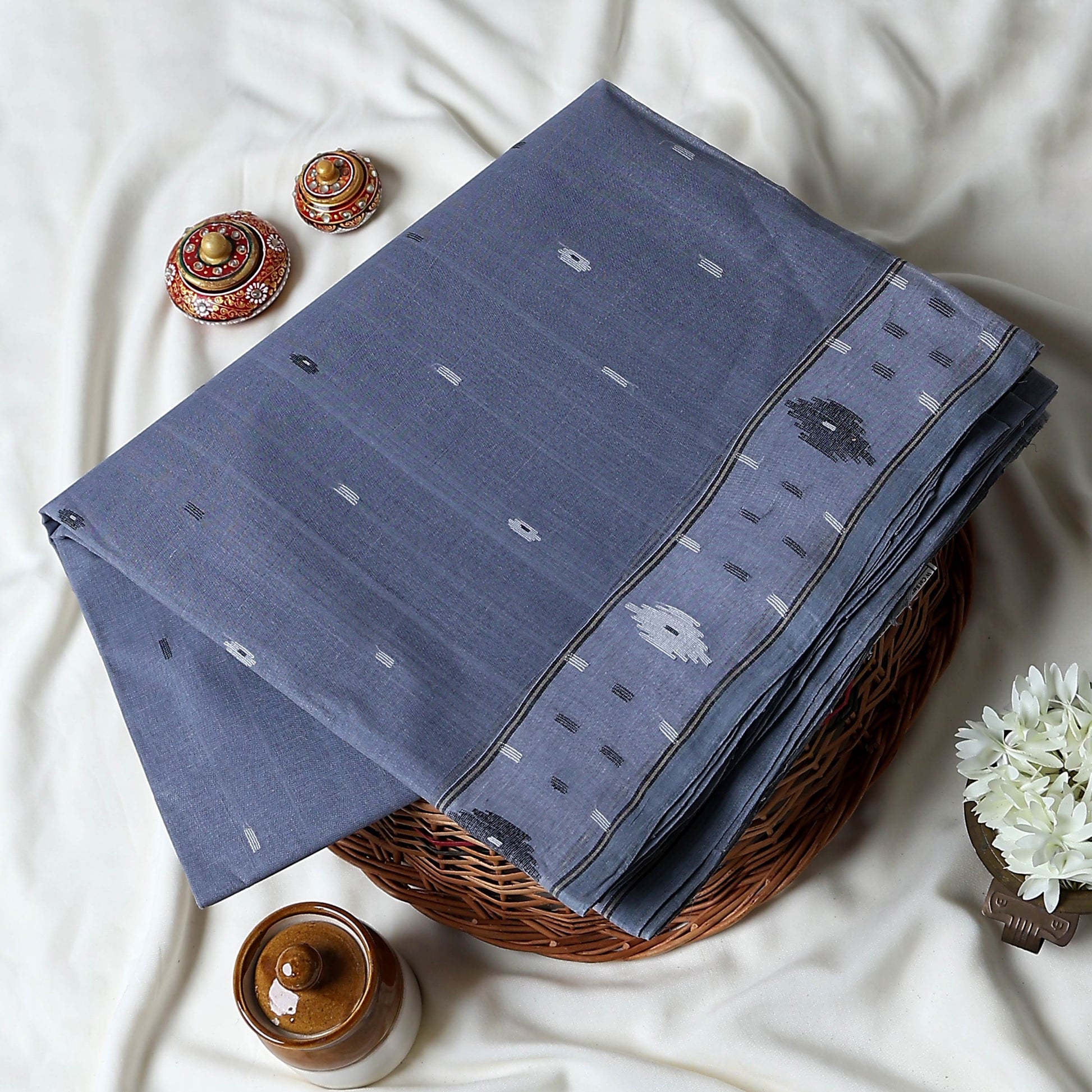 Bengal Cotton Saree With Woven Buti Motifs And Contrast Border In Grey Folded Display  - Close Up View