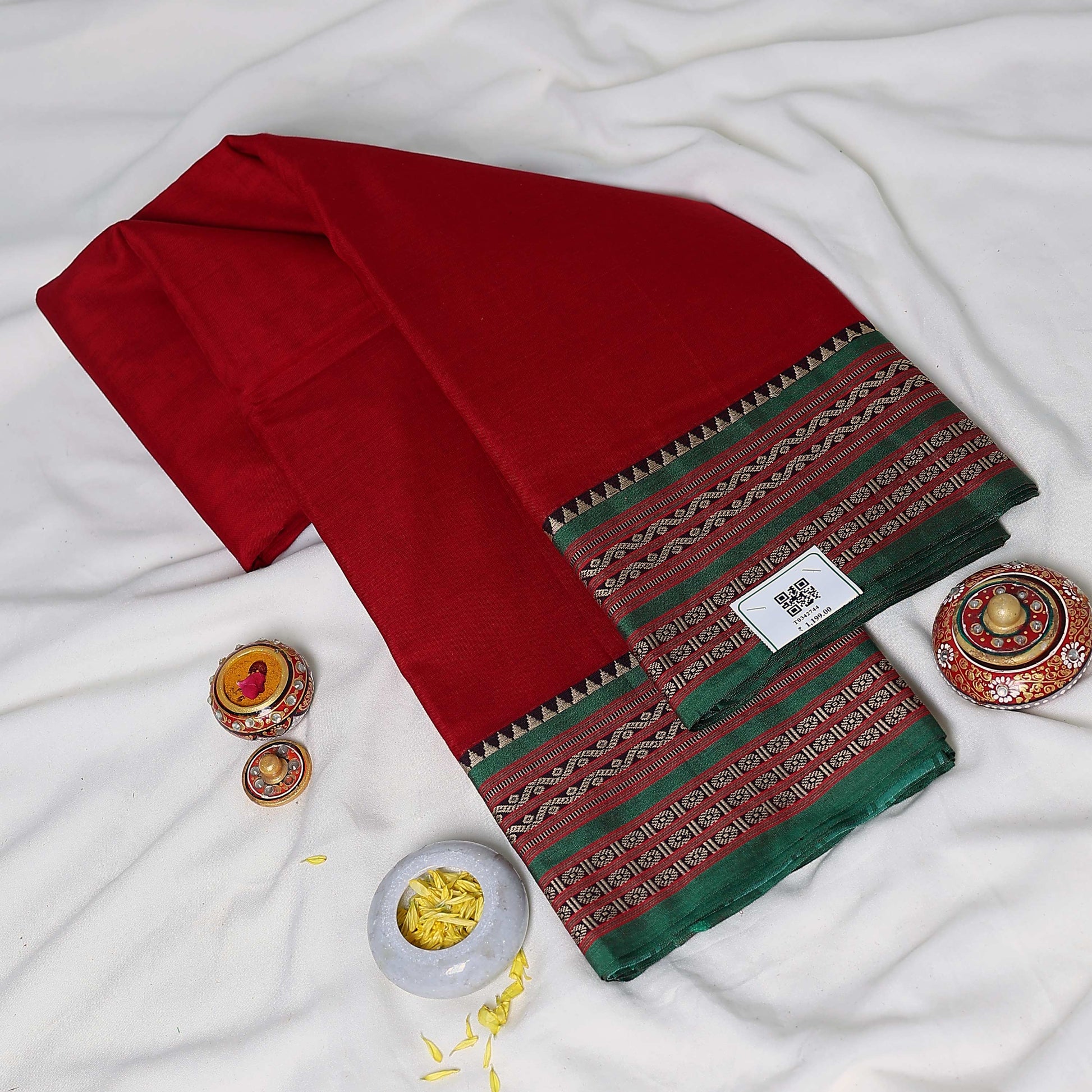Mangalagiri Cotton Saree With A Solid Body And Traditional Woven Contrast Border Featuring Geometric And Floral Motifs
