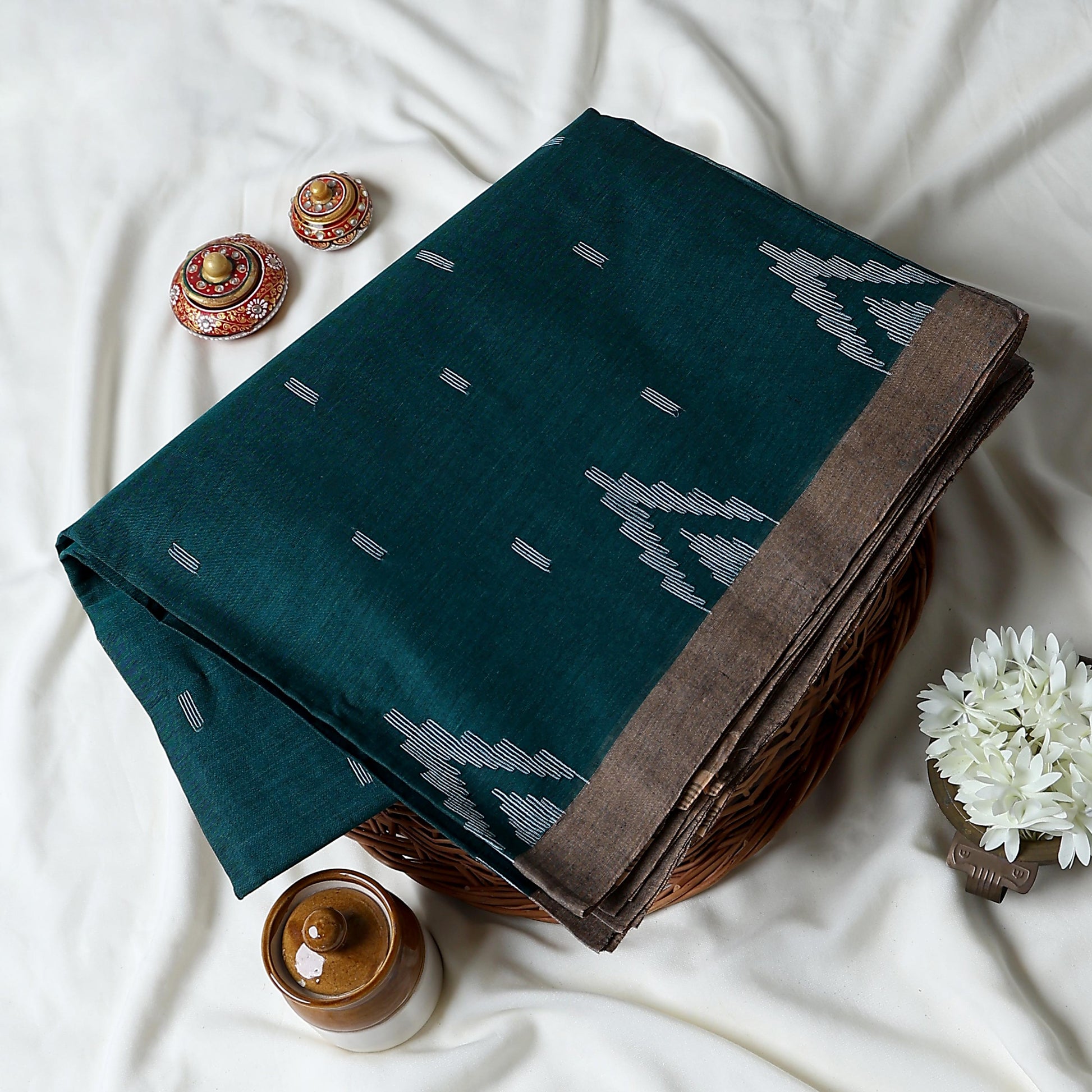 Bengal Cotton Saree With White Woven Butti Motifs And Plain Taupe Border In Teal Blue Folded Flat View