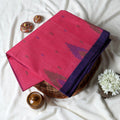 Bengal Cotton Saree With White Woven Butti Motifs And Plain Blue Border In Dark Pink Folded Flat View
