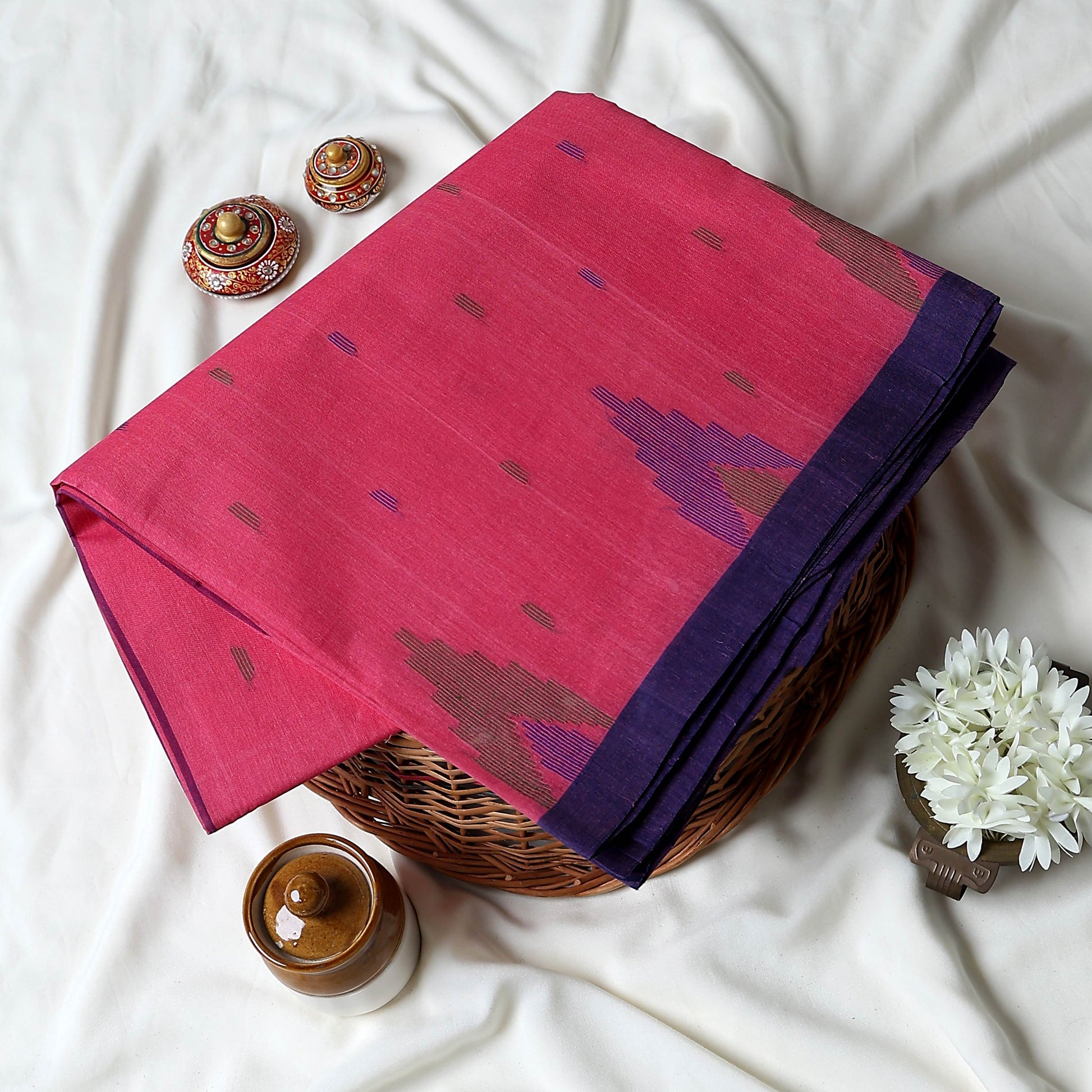 Bengal Cotton Saree With White Woven Butti Motifs And Plain Blue Border In Dark Pink Folded Flat View