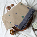 Bengal Cotton Saree With White Woven Butti Motifs And Plain Dark Grey Border In Cream Folded Flat View