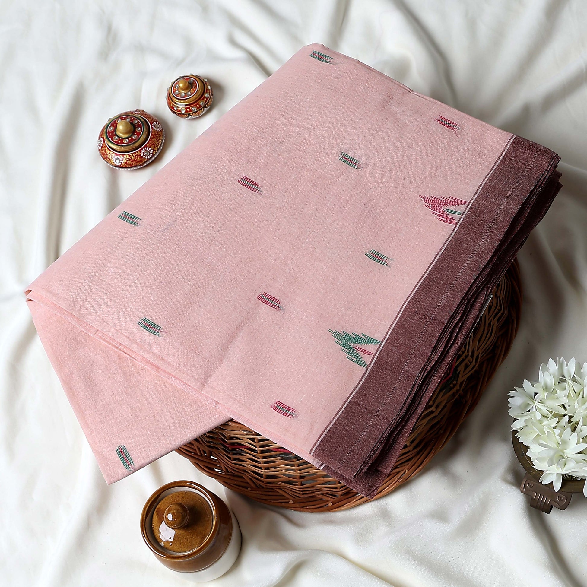 Bengal Cotton Saree With White Woven Butti Motifs And Plain Brown Border In Light Peach Folded Flat View