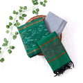 Top View Of Green And Grey Salwar Suit Material With Striped Dupatta Ikkat Woven Borders,Tassel Details And Matching Fabric Piece