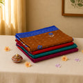 Voile cotton saree stack collection in assorted colors with floral motifs and decorative borders front view