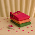Kanchi cotton saree with contrast zari border in pink, orange and green shades folded stack front view