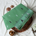 Bengal Cotton Saree With White Woven Butti Motifs And Plain Light Green Border In Light Green Folded Flat View