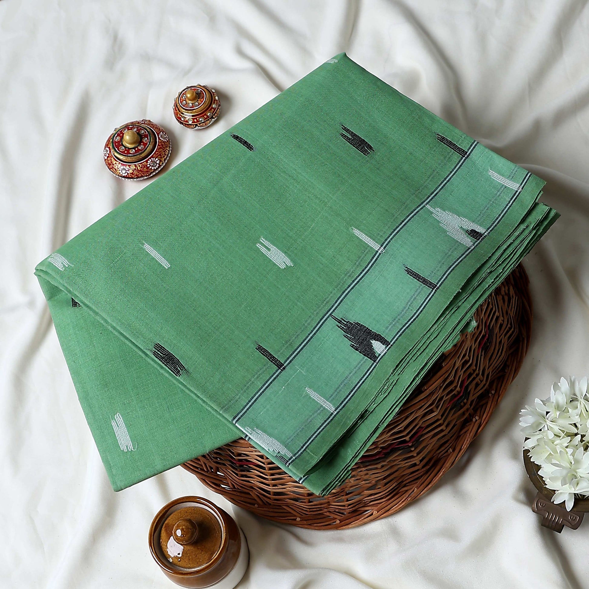 Bengal Cotton Saree With White Woven Butti Motifs And Plain Light Green Border In Light Green Folded Flat View