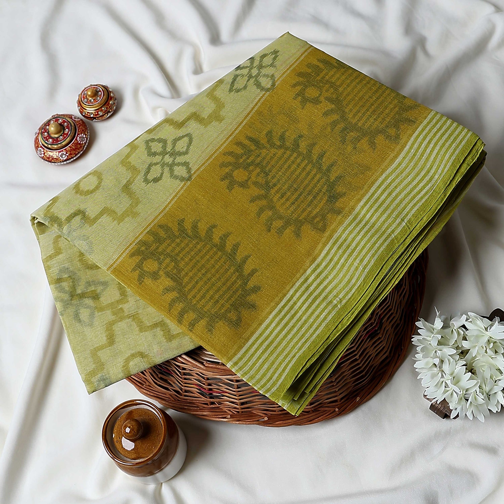 Yellow Bengal Cotton Saree Featuring Floral Butta Motifs And Striped Border Folded Product Close Up View